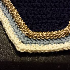 Navy, light blue and cream square front with beige scroll cord.